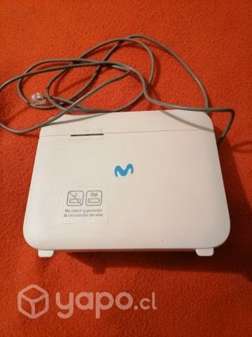 Un router con todos sus accesorios y su caja.