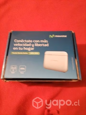 Un router con todos sus accesorios y su caja.