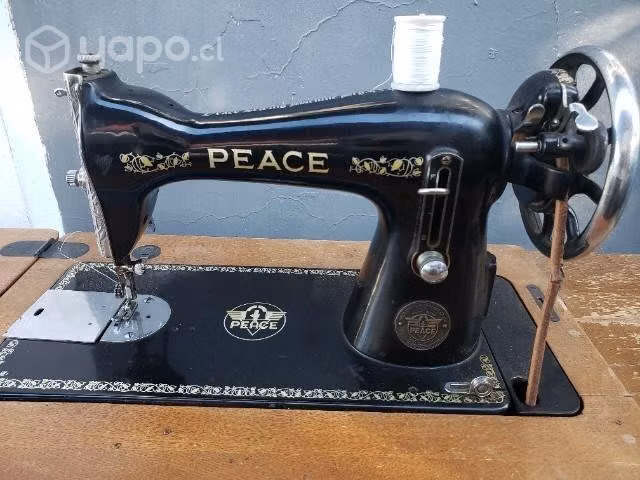 Antigua maquina de coser Peace excelente