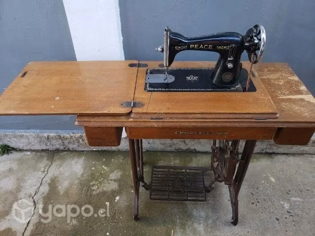 Antigua maquina de coser Peace excelente