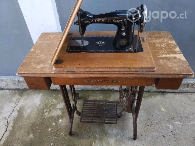 Antigua maquina de coser Peace excelente