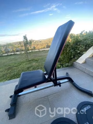 Discos, barra olimpica, banco reclinable