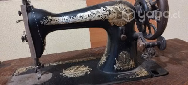 Máquina de coser ,singer antigua.