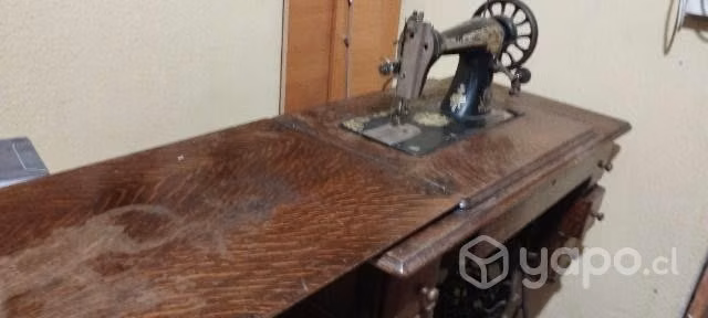 Máquina de coser ,singer antigua.