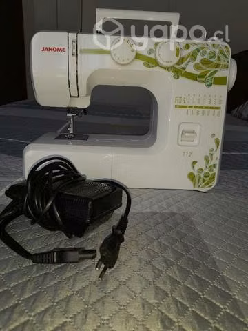 Máquina de coser marca Janome 712