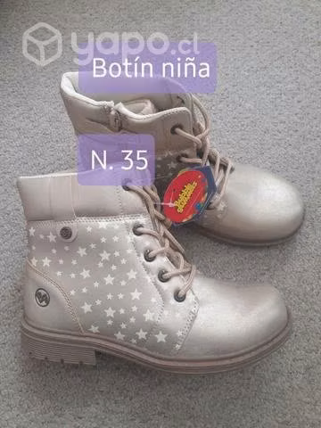 Botín dorado con estrellas