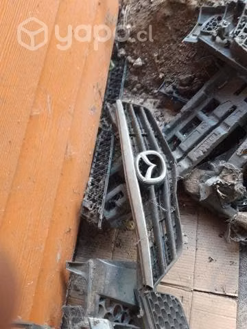 Mascara delantera original mazda 626 2003