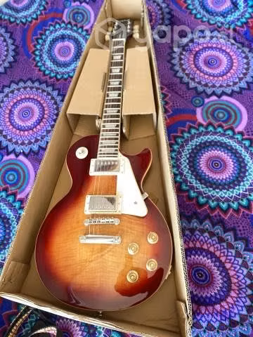 Guitarra eléctrica les paul y amplificador vox