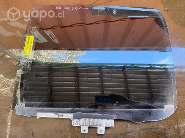 Vidrio original tinteado puerta tras izq Colorado