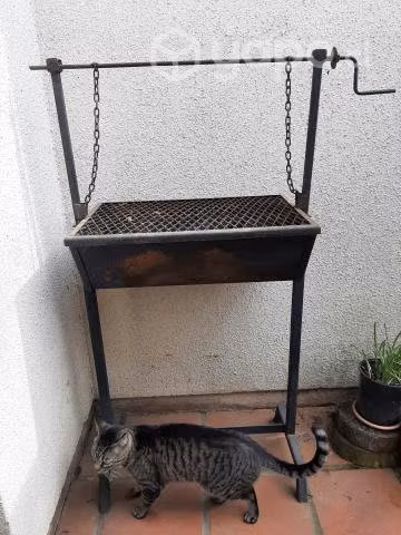 Parrilla con regulador de altura
