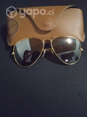 Lentes ray-ban modelo aviador dorado