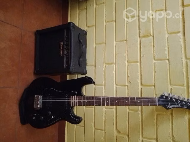 guitarra electrica con su amplificador.
