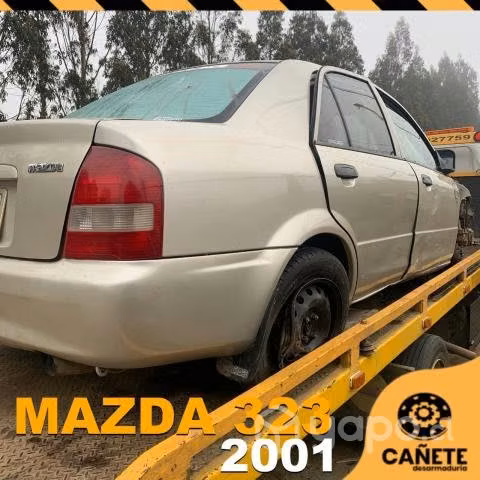 Frontal Mazda 323 2001