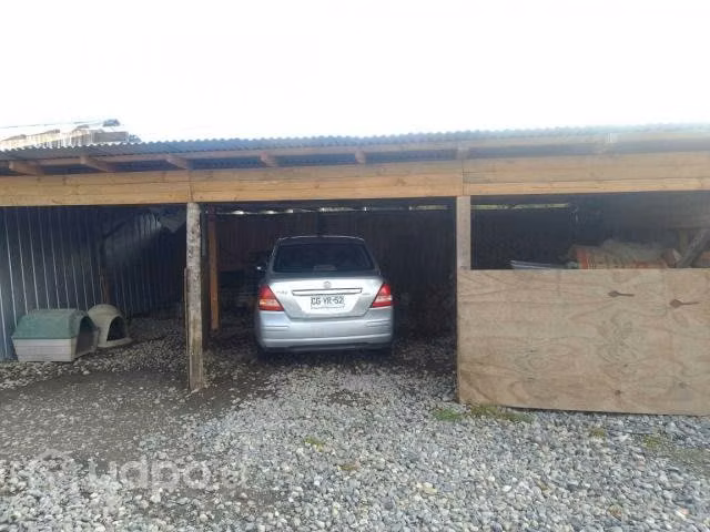 Terreno con casa y bodega