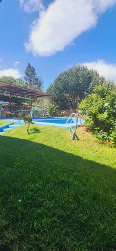 PARCELA CON CASA, PISCINA Y QUINCHO (69776)