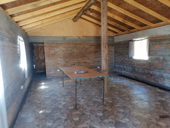 vendo parcela en Villarrica con cabaña construcción solida
