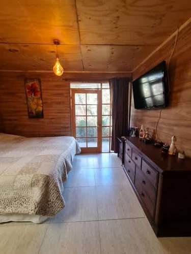 CHIU CHUI, VENDE O PERMUTA TERRENO 5.000.- m2 CASA Y HOSTAL