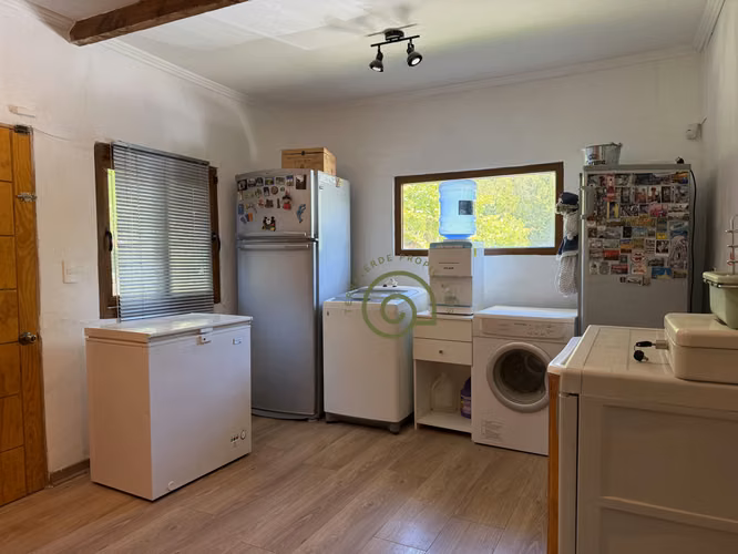 VENTA DE PARCELA CON PISCINA Y HERMOSO JARDÍN