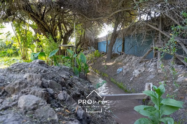 Parcela casa principal, más 2 cabañas, con derecho de agua