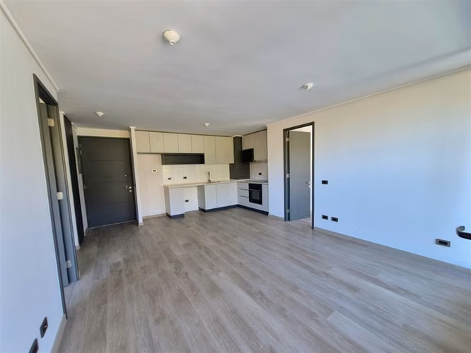 Departamento en venta de 2 dorm. con jardín en Huechuraba
