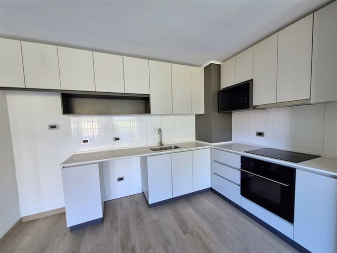 Departamento en venta de 2 dorm. con jardín en Huechuraba