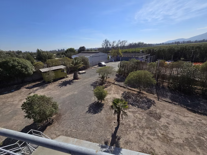 CALERA DE TAGO: PROPIEDAD 5.000 M2, CON PATIO ASFALTADO, 300 M2 OFIC. Y CASA CUIDADOR