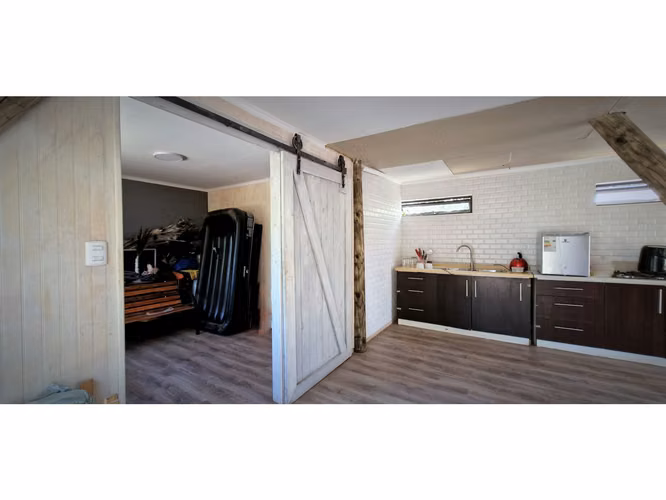 Venta de parcela con casa de 1 dormitorio, en Condominio exclusivo en La Cruz. 5.857 UF.