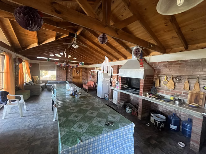 Oportunidad se Vende parcela, con gran quincho, piscina y paltos en produccion