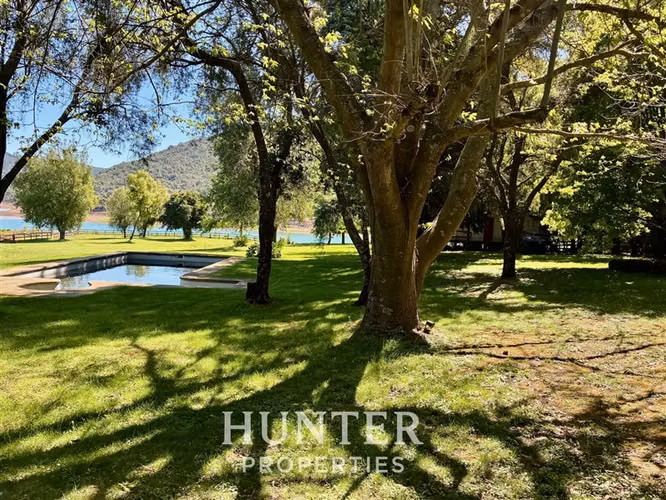 Terreno de 5.000 m2 y 3 casas, piscina en colbun lado norte