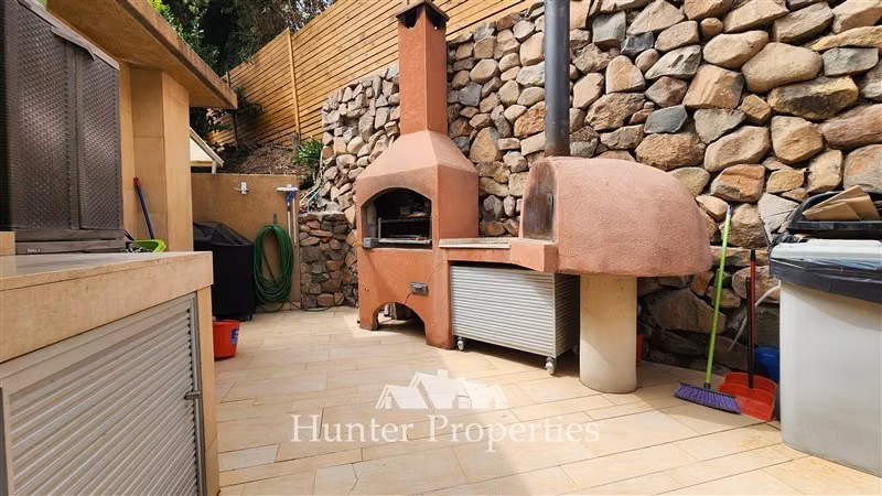 Casa en venta de 5D y 5B en Cond La Reserva. Colina