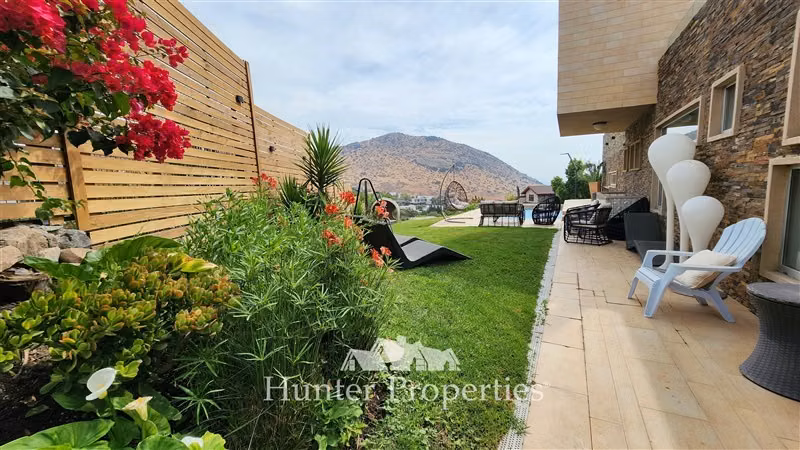Venta de parcela con casa 5D y 5B en Cond La Reserva. Colina