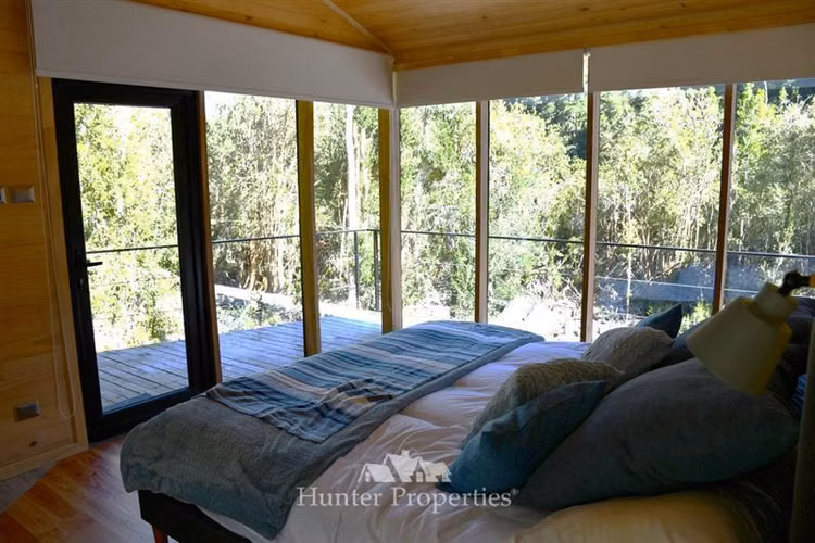 Parcela- casa boutique en venta, orilla Río Puelo, Cochamó