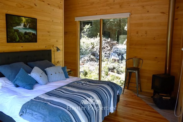 Parcela- casa boutique en venta, orilla Río Puelo, Cochamó