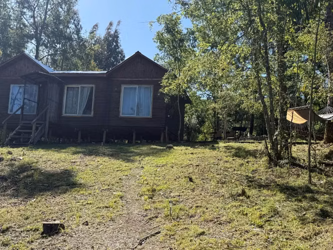 Parcela con cabaña en venta
