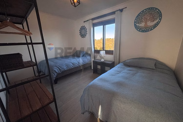 Parcela con 2 casas linda vista a la montaña