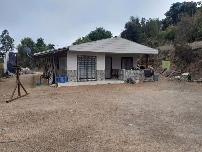 Pequeña parcela con casa
