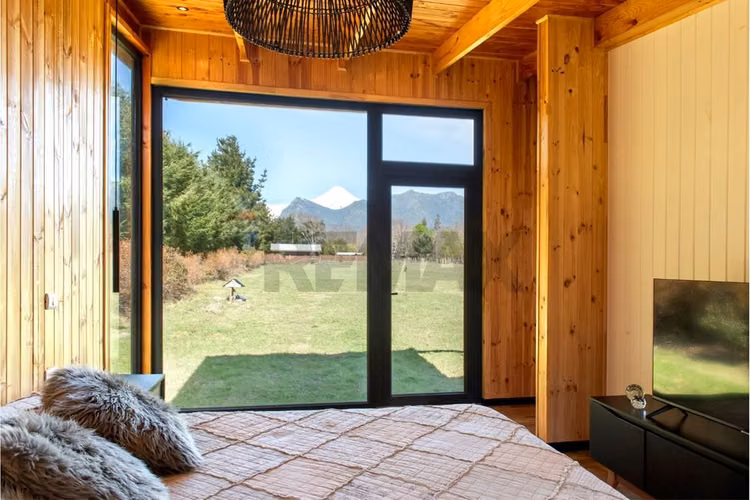 Parcela con casa vista al volcán