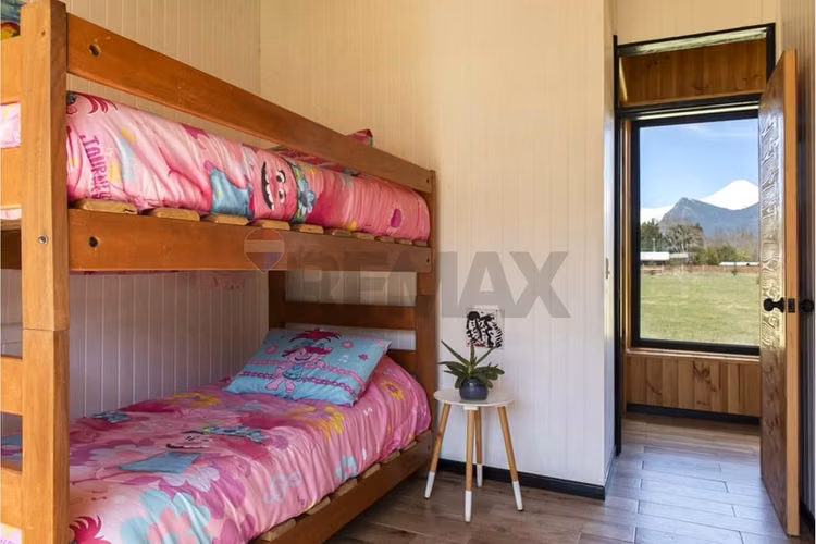 Parcela con casa vista al volcán
