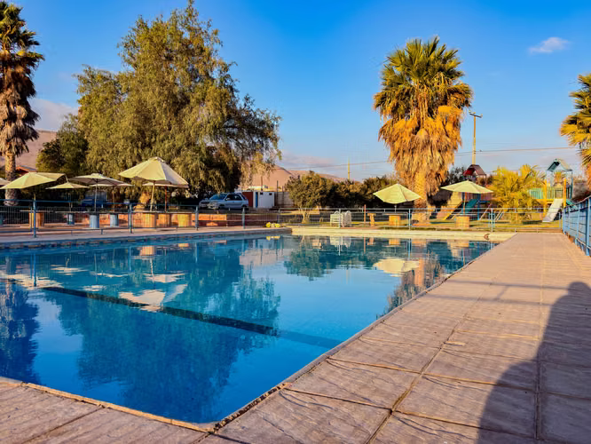 PARCELA EN VALLE DE AZAPA DE 5.128 m² CON 3 CASAS, PISCINA Y JUEGOS INFANTILES