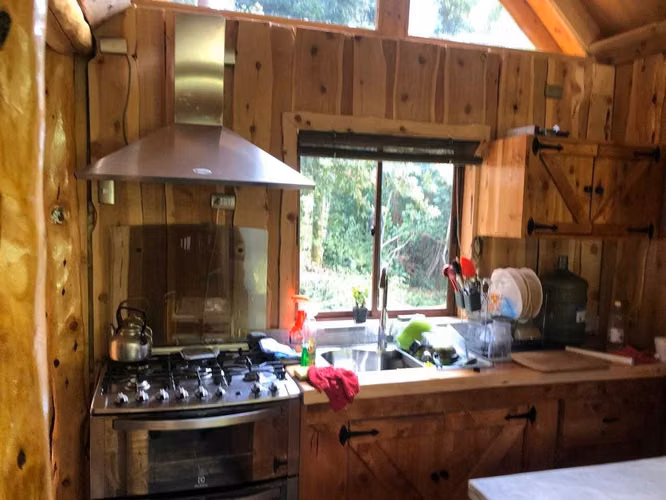 Terreno y cabaña  en LLanada Grande, Cochamó.