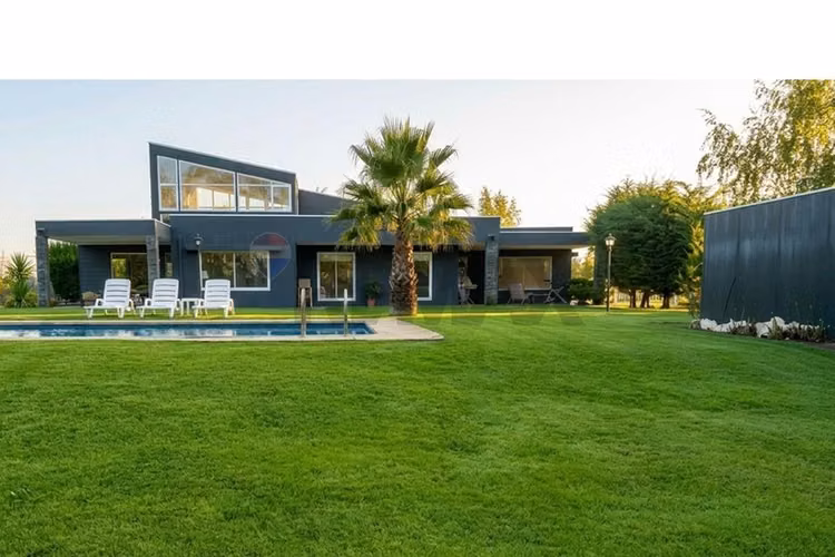 Venta parcela con casa en parral