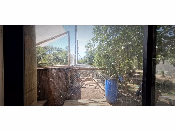 Venta de parcela con casa de 1 dormitorio, en Condominio exclusivo en La Cruz. 5.857 UF.