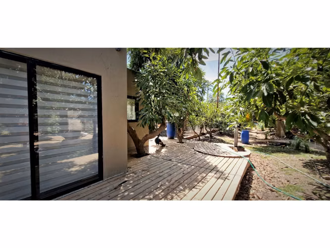 Venta de parcela con casa de 1 dormitorio, en Condominio exclusivo en La Cruz. 5.857 UF.