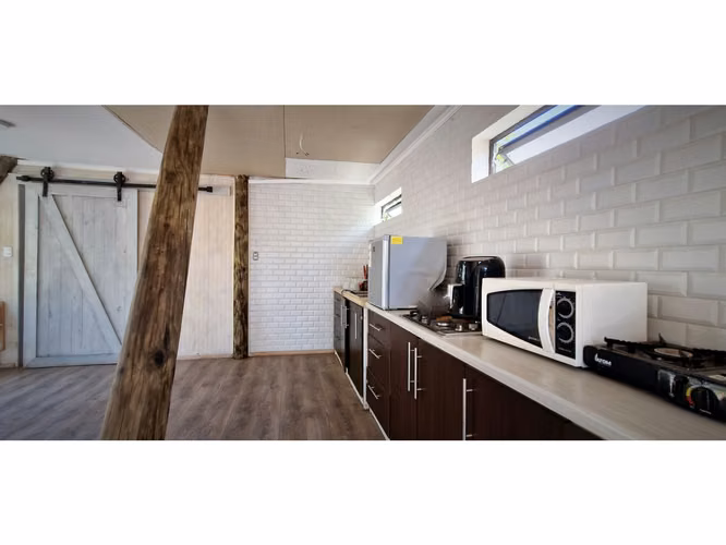 Venta de parcela con casa de 1 dormitorio, en Condominio exclusivo en La Cruz. 5.857 UF.