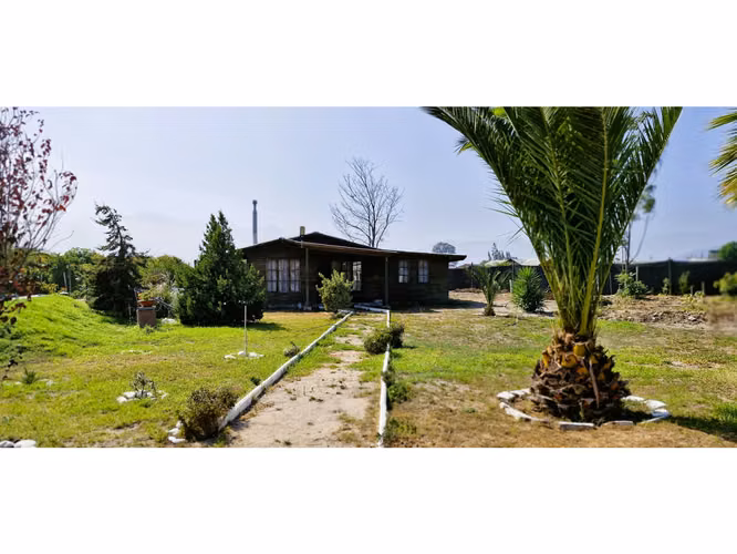 Venta parcela de 18.000 m2., casa, cabaña y galpón, con maquinaria de maestranza, en La Calera. 21.308 UF.