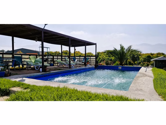 Venta parcela de 18.000 m2., casa, cabaña y galpón, con maquinaria de maestranza, en La Calera. 21.308 UF.