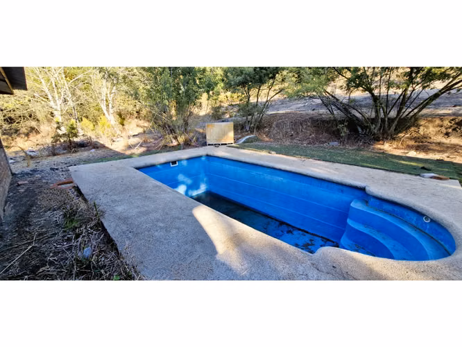 Venta de parcela de 15.000 m2., con casa, quincho y piscina, en Pucalán. 200 M$
