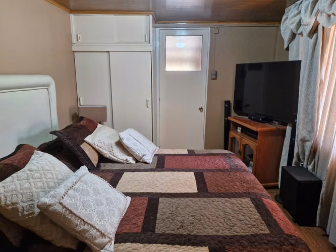Gestimob vende amplia casa de un piso en pasaje Aulén , Villa Robert Kennedy, Estación Central - Imagen 6