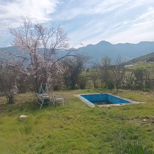 vendo parcela de 5000 mt2 con 3 casas funcionando