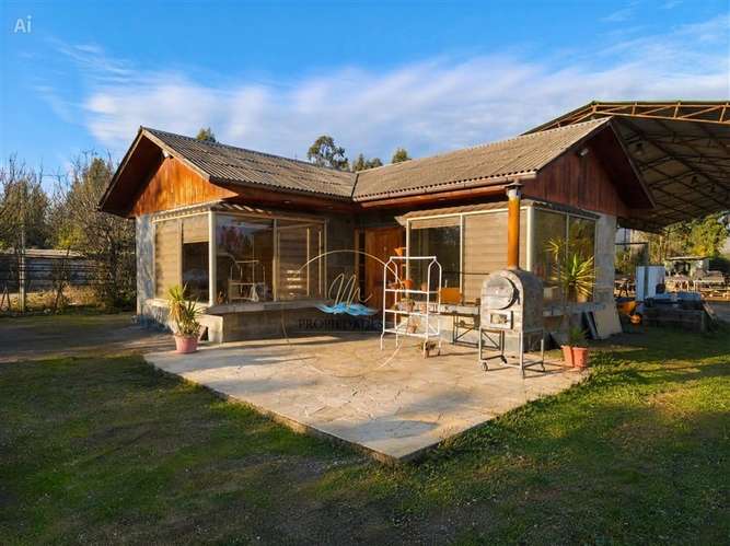 CASA CON GRAN TERRENO Y GALPÓN COMERCIAL